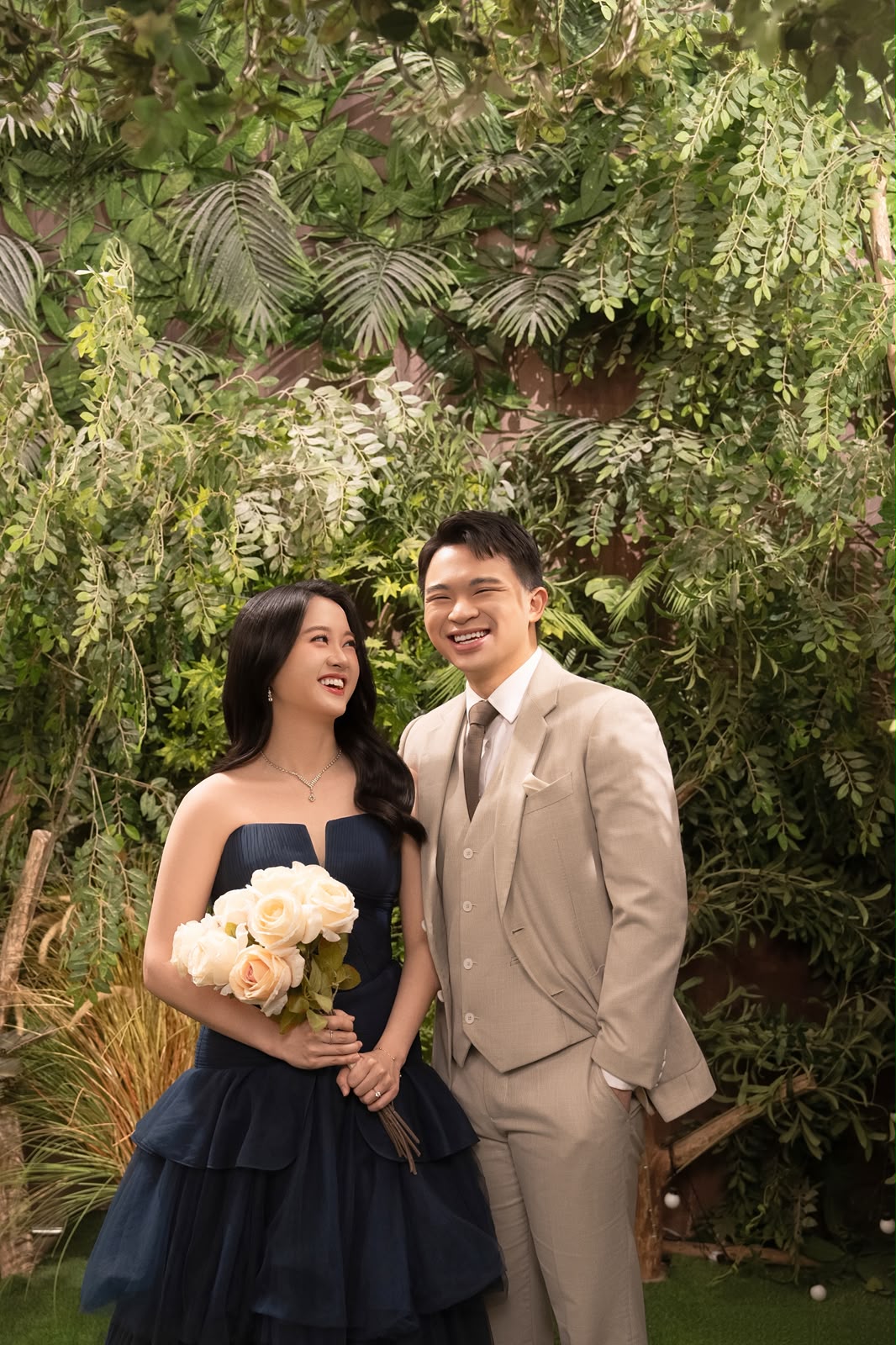 Kelwin and Christy among green foliage